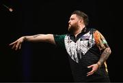 21 March 2024; Michael Smith in action against Luke Littler during their match at the BetMGM Premier League Darts at the 3Arena in Dublin. Photo by Ben McShane/Sportsfile