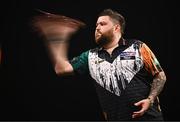 21 March 2024; Michael Smith in action during his match against Luke Littler at the BetMGM Premier League Darts at the 3Arena in Dublin. Photo by Ben McShane/Sportsfile