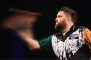 21 March 2024; Michael Smith in action during his match against Luke Littler at the BetMGM Premier League Darts at the 3Arena in Dublin. Photo by Ben McShane/Sportsfile