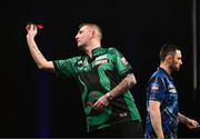 21 March 2024; Nathan Aspinall in action during his semi-final match against Luke Humphries at the BetMGM Premier League Darts at the 3Arena in Dublin. Photo by Ben McShane/Sportsfile