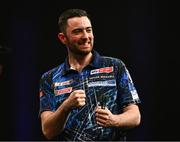 21 March 2024; Luke Humphries celebrates after victory in his semi-final match against Nathan Aspinall at the BetMGM Premier League Darts at the 3Arena in Dublin. Photo by Ben McShane/Sportsfile