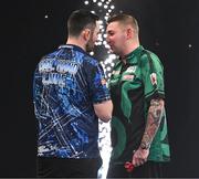 21 March 2024; Luke Humphries, left, and Nathan Aspinall after their semi-final match at the BetMGM Premier League Darts at the 3Arena in Dublin. Photo by Ben McShane/Sportsfile