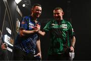 21 March 2024; Luke Humphries, left, and Nathan Aspinall after their semi-final match at the BetMGM Premier League Darts at the 3Arena in Dublin. Photo by Ben McShane/Sportsfile