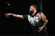 21 March 2024; Michael Smith in action during his final match against Luke Humphries at the BetMGM Premier League Darts at the 3Arena in Dublin. Photo by Ben McShane/Sportsfile
