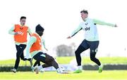 22 March 2024; Evan Ferguson, right, with Festy Ebosele and Jamie McGrath, left, during a Republic of Ireland training session at the FAI National Training Centre in Abbotstown, Dublin. Photo by Stephen McCarthy/Sportsfile