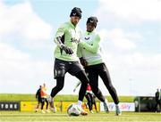 22 March 2024; Goalkeeper Caoimhin Kelleher and Chiedozie Ogbene, right, during a Republic of Ireland training session at the FAI National Training Centre in Abbotstown, Dublin. Photo by Stephen McCarthy/Sportsfile