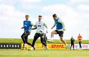 22 March 2024; Seamus Coleman, right, with Nathan Collins, left, and Evan Ferguson during a Republic of Ireland training session at the FAI National Training Centre in Abbotstown, Dublin. Photo by Stephen McCarthy/Sportsfile