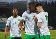 22 March 2024; Sinclair Armstrong of Republic of Ireland, centre, celebrates after scoring his side's first goal with team-mates Andrew Moran, right, and Tayo Adaramola, left, during the UEFA European Under-21 Championship qualifier match between San Marino and Republic of Ireland at San Marino Stadium in Serravalle, San Marino. Photo by Roberto Bregani/Sportsfile