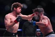 22 March 2024; Ciaran Clarke, left, in action against Darius Mafi in their bantamweight bout during the Bellator Champions Series at the SSE Arena in Belfast. Photo by David Fitzgerald/Sportsfile