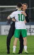 22 March 2024; Republic of Ireland manager Jim Crawford embraces Andrew Moran after the UEFA European Under-21 Championship qualifier match between San Marino and Republic of Ireland at San Marino Stadium in Serravalle, San Marino. Photo by Roberto Bregani/Sportsfile