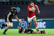 22 March 2024; Antoine Frisch of Munster evades the tackle of Evardi Boshoff of Ospreys during the United Rugby Championship match between Ospreys and Munster at the Swansea.com Stadium in Swansea, Wales. Photo by Chris Fairweather/Sportsfile