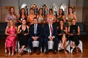 22 March 2024; The Ladies HEC All-Stars 2024 team, back row, from left to right, Muirios O'Leary, receiving on behalf of her sister, Danielle O’Leary of Munster Technological University Kerry; Kellyann Hogan of University College Cork; Rosie Corkery of University College Cork; Emily Lacey of University College Cork; Ellie Jack of University College Cork; Claire Dunne of DCU Dóchas Éireann and Emma Duggan of DCU Dóchas Éireann. Front row, from left to right, Abigail Ring of University College Cork; Dara Kiniry of University College Cork; Uachtarán Cumann Peil Gael na mBan, Mícheál Naughton; Ladies HEC chairperson Daniel Caldwell; Robyn Murray of DCU Dóchas Éireann and Kate Kenny of DCU Dóchas Éireann, during the 2024 HEC All Stars awards night at the Dublin Bonnington Hotel in Dublin. Photo by Ramsey Cardy/Sportsfile