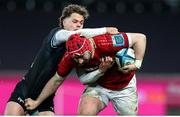 22 March 2024; John Hodnett of Munster is tackled by Jack Walsh of Ospreys during the United Rugby Championship match between Ospreys and Munster at the Swansea.com Stadium in Swansea, Wales. Photo by Chris Fairweather/Sportsfile