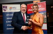22 March 2024; Rosie Corkery of University College Cork receives her All-Star award from Ladies HEC chairperson Daniel Caldwell during the 2024 HEC All Stars awards night at the Dublin Bonnington Hotel in Dublin. Photo by Ramsey Cardy/Sportsfile