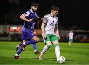 22 March 2024; Harry Nevin of Cork City in action against Oisin O'Reilly of Treaty United during the SSE Airtricity Men's First Division match between Treaty United and Cork City at Markets Field in Limerick. Photo by Michael P Ryan/Sportsfile
