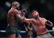 22 March 2024; Karl Moore, right, in action against Corey Anderson in their light heavyweight title bout during the Bellator Champions Series at the SSE Arena in Belfast. Photo by David Fitzgerald/Sportsfile