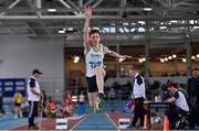 23 March 2024; Darragh Kelly of Craughwell AC, Galway, competes in the boys under 18 triple jump during day one of the 123.ie National Juvenile Indoor Championships at the TUS International Arena in Athlone. Photo by Stephen Marken/Sportsfile