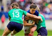 23 March 2024; Gabrielle Vernier of France is tackled by Eve Higgins of Ireland, left, during the Women's Six Nations Rugby Championship match between France and Ireland at Stade Marie-Marvingt in Le Mans, France. Photo by Hugo Pfeiffer/Sportsfile