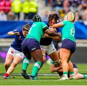 23 March 2024; Manaé Feleu of France is tackled by Linda Djougang, left, and Aoife Dalton of Ireland during the Women's Six Nations Rugby Championship match between France and Ireland at Stade Marie-Marvingt in Le Mans, France. Photo by Hugo Pfeiffer/Sportsfile