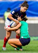 23 March 2024; Gabrielle Vernier of France is tackled by Brittany Hogan of Ireland during the Women's Six Nations Rugby Championship match between France and Ireland at Stade Marie-Marvingt in Le Mans, France. Photo by Hugo Pfeiffer/Sportsfile