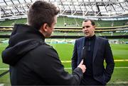 23 March 2024; Republic of Ireland interim head coach John O'Shea is interviewed by FAI Communications manager Kieran Crowley before the international friendly match between Republic of Ireland and Belgium at the Aviva Stadium in Dublin. Photo by Stephen McCarthy/Sportsfile