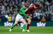 23 March 2024; Evan Ferguson of Republic of Ireland in action against Wout Faes of Belgium during the international friendly match between Republic of Ireland and Belgium at the Aviva Stadium in Dublin. Photo by Stephen McCarthy/Sportsfile