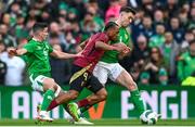 23 March 2024; Loïs Openda of Belgium in action against Josh Cullen, left, and Dara O'Shea of Republic of Ireland during the international friendly match between Republic of Ireland and Belgium at the Aviva Stadium in Dublin. Photo by Stephen McCarthy/Sportsfile