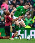 23 March 2024; Dara O'Shea of Republic of Ireland and Loïs Openda of Belgium during the international friendly match between Republic of Ireland and Belgium at the Aviva Stadium in Dublin. Photo by Stephen McCarthy/Sportsfile