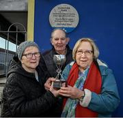 23 March 2024; Margartet Lane, Kevin Barry Murphy and Mary Lane with the cup from 1890 at the official unveiling of a plaque by Dublin City Council and the GAA at Clonturk Park in Drumcondra, commemorating it as a location for the All-Ireland hurling and football finals of 1890, 1891, 1892 and 1894. Photo by Ray McManus/Sportsfile
