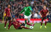 23 March 2024; Chiedozie Ogbene of Republic of Ireland is tackled by Olivier Deman of Belgium during the international friendly match between Republic of Ireland and Belgium at the Aviva Stadium in Dublin. Photo by Seb Daly/Sportsfile
