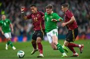 23 March 2024; Evan Ferguson of Republic of Ireland in action against Aster Vranckx, left, and Timothy Castagne of Belgium during the international friendly match between Republic of Ireland and Belgium at the Aviva Stadium in Dublin. Photo by Stephen McCarthy/Sportsfile