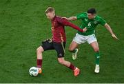 23 March 2024; Arthur Vermeeren of Belgium in action against Josh Cullen of Republic of Ireland during the international friendly match between Republic of Ireland and Belgium at the Aviva Stadium in Dublin. Photo by David Fitzgerald/Sportsfile