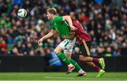 23 March 2024; Nathan Collins of Republic of Ireland in action against Loïs Openda of Belgium during the international friendly match between Republic of Ireland and Belgium at the Aviva Stadium in Dublin. Photo by Stephen McCarthy/Sportsfile