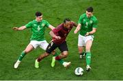 23 March 2024; Loïs Openda of Belgium in action against Josh Cullen, left, and Dara O'Shea of Republic of Ireland during the international friendly match between Republic of Ireland and Belgium at the Aviva Stadium in Dublin. Photo by David Fitzgerald/Sportsfile