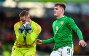23 March 2024; Belgium goalkeeper Matz Sels makes a save under pressure from Evan Ferguson of Republic of Ireland during the international friendly match between Republic of Ireland and Belgium at the Aviva Stadium in Dublin. Photo by Seb Daly/Sportsfile