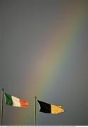 23 March 2024; The Irish tricolour and the Kilkenny flags fly in the wind as a rainbow appears after the Allianz Hurling League Division 1 semi-final match between Limerick and Kilkenny at SuperValu Páirc Ui Chaoimh in Cork. Photo by Brendan Moran/Sportsfile