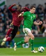 23 March 2024; Seamus Coleman of Republic of Ireland in action against Jérémy Doku of Belgium during the international friendly match between Republic of Ireland and Belgium at the Aviva Stadium in Dublin. Photo by Stephen McCarthy/Sportsfile