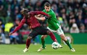 23 March 2024; Jérémy Doku of Belgium in action against Seamus Coleman of Republic of Ireland during the international friendly match between Republic of Ireland and Belgium at the Aviva Stadium in Dublin. Photo by Stephen McCarthy/Sportsfile