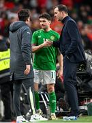 23 March 2024; Robbie Brady of Republic of Ireland with Republic of Ireland assistant coach Paddy McCarthy, left, and Republic of Ireland interim head coach John O'Shea during the international friendly match between Republic of Ireland and Belgium at the Aviva Stadium in Dublin. Photo by Stephen McCarthy/Sportsfile