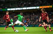 23 March 2024; Festy Ebosele of Republic of Ireland in action against Olivier Deman, left, and Wout Faes of Belgium during the international friendly match between Republic of Ireland and Belgium at the Aviva Stadium in Dublin. Photo by Stephen McCarthy/Sportsfile