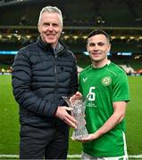 23 March 2024; Josh Cullen of Republic of Ireland is presented with the player of the match award by Sky Ireland CEO JD Buckley after the international friendly match between Republic of Ireland and Belgium at the Aviva Stadium in Dublin. Photo by Stephen McCarthy/Sportsfile