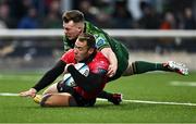 23 March 2024; Erich Cronje of Emirates Lions scores his side's fourth try despite pressure from David Hawhshaw of Connacht during the United Rugby Championship match between Connacht and Emirates Lions at Dexcom Stadium in Galway. Photo by Piaras Ó Mídheach/Sportsfile