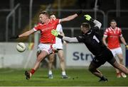 23 March 2024; Ryan Burns of Louth shoots to score his side's first goal past Kildare goalkeeper Mark Donnellan during the Allianz Football League Division 2 match between Kildare and Louth at Netwatch Cullen Park in Carlow. Photo by Michael P Ryan/Sportsfile