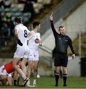 23 March 2024; Mick O'Grady of Kildare, 3, is shown a yellow card by referee Joe McQuillan during the Allianz Football League Division 2 match between Kildare and Louth at Netwatch Cullen Park in Carlow. Photo by Michael P Ryan/Sportsfile