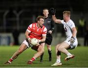 23 March 2024; Conor Grimes of Louth in action against Shane Farrell of Kildare during the Allianz Football League Division 2 match between Kildare and Louth at Netwatch Cullen Park in Carlow. Photo by Michael P Ryan/Sportsfile