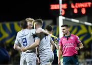 23 March 2024; Rob Russell of Leinster celebrates with teammates Luke McGrath and Jamie Osborne after scoring his side's first try during the United Rugby Championship match between Zebre Parma and Leinster at Stadio Sergio Lanfranchi in Parma, Italy. Photo by Harry Murphy/Sportsfile