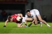 23 March 2024; Ciaran Keenan of Louth is tackled by Mick O'Grady of Kildare during the Allianz Football League Division 2 match between Kildare and Louth at Netwatch Cullen Park in Carlow. Photo by Michael P Ryan/Sportsfile