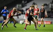 23 March 2024; Conor Turbitt of Armagh in action against Brian O'Driscoll and Steven Sherlock of Cork during the Allianz Football League Division 2 match between Cork and Armagh at SuperValu Páirc Ui Chaoimh in Cork. Photo by Brendan Moran/Sportsfile