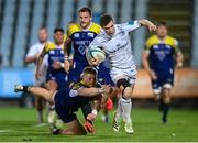 23 March 2024; Luke McGrath of Leinster evades the tackle of Scott Gregory of Zebre during the United Rugby Championship match between Zebre Parma and Leinster at Stadio Sergio Lanfranchi in Parma, Italy. Photo by Harry Murphy/Sportsfile