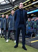 23 March 2024; Republic of Ireland interim head coach John O'Shea and coaches, from right, assistant coach Paddy McCarthy, assistant coach Glenn Whelan and goalkeeping coach Rene Gilmartin stand for the playing of the National Anthem before the international friendly match between Republic of Ireland and Belgium at the Aviva Stadium in Dublin. Photo by Stephen McCarthy/Sportsfile